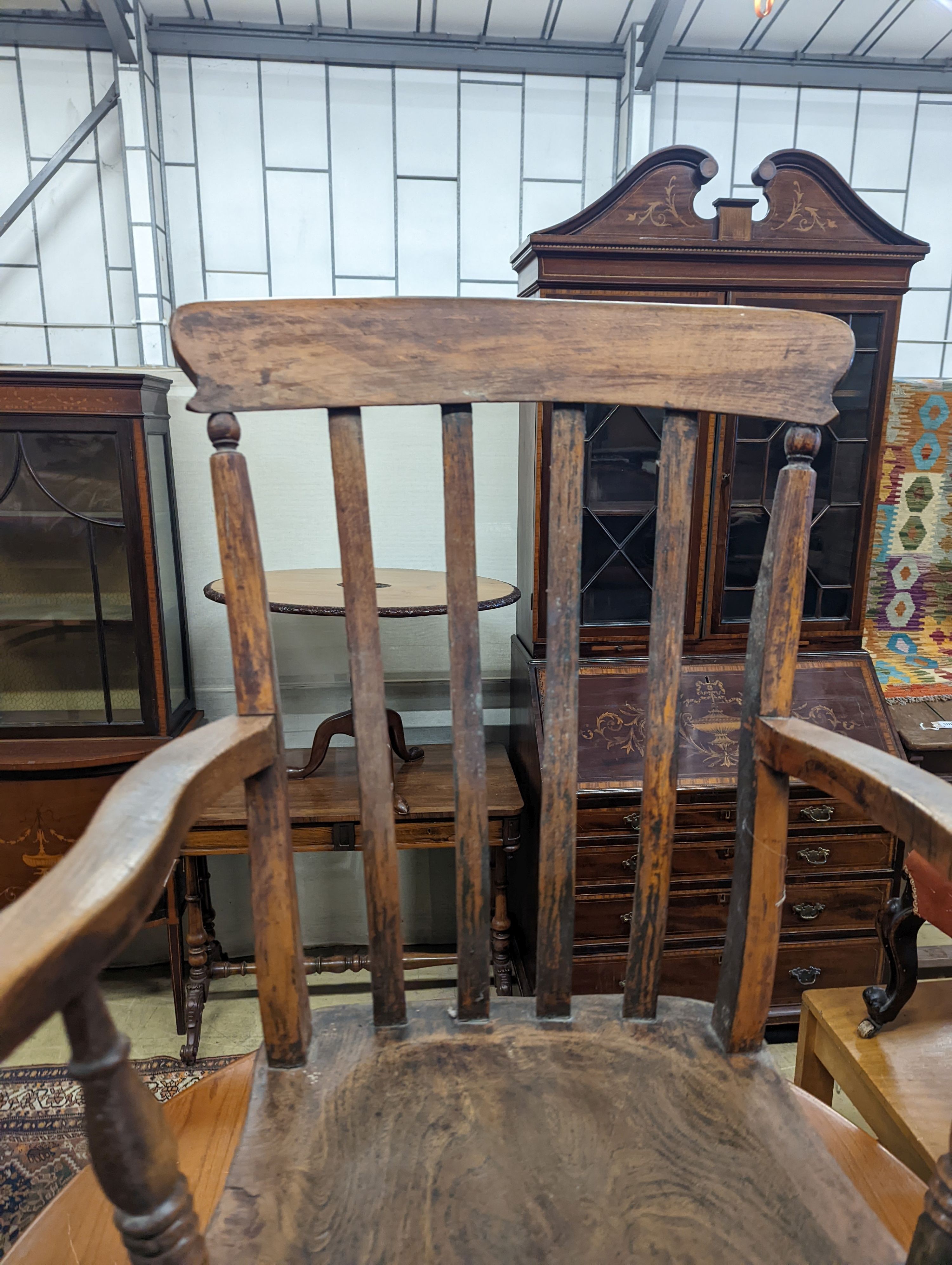 A Victorian elm and beech Windsor lathe back elbow chair, width 58cm, depth 47cm, height 109cm